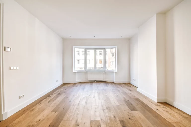 renovated room with a window installed and laminate flooring installed