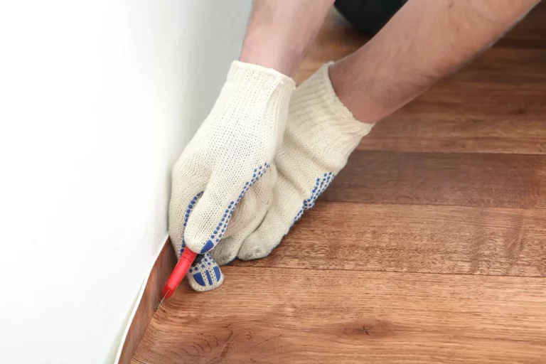 Laying and trimming linoleum during renovation