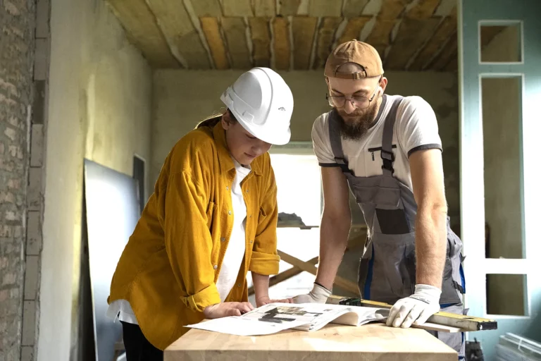 The customer and the foreman discuss the wall dismantling project